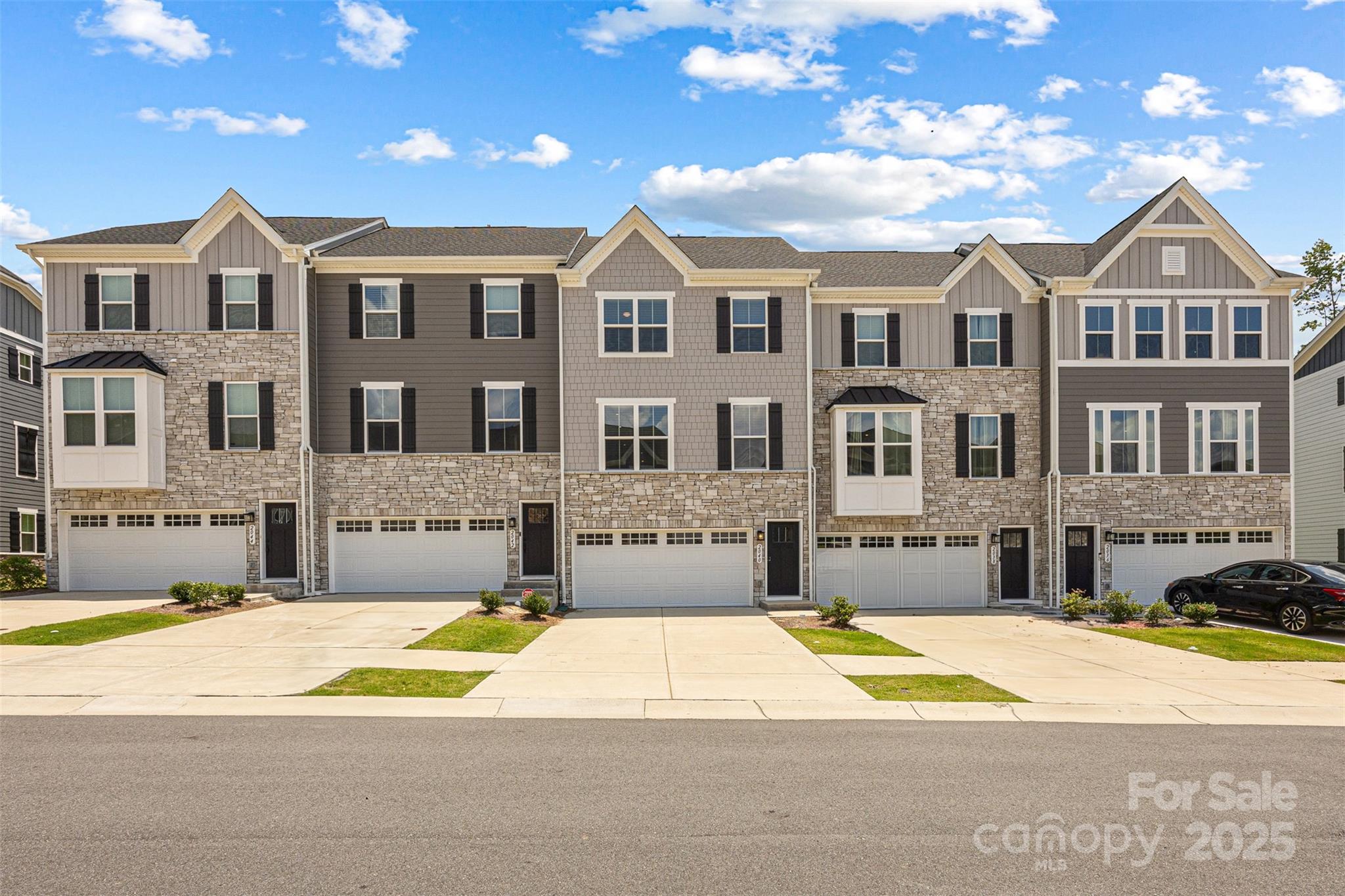 2040 Dornoch Road Tega Cay, SC 29708 - Photo 1 of 30 a view of houses with yard and swimming pool