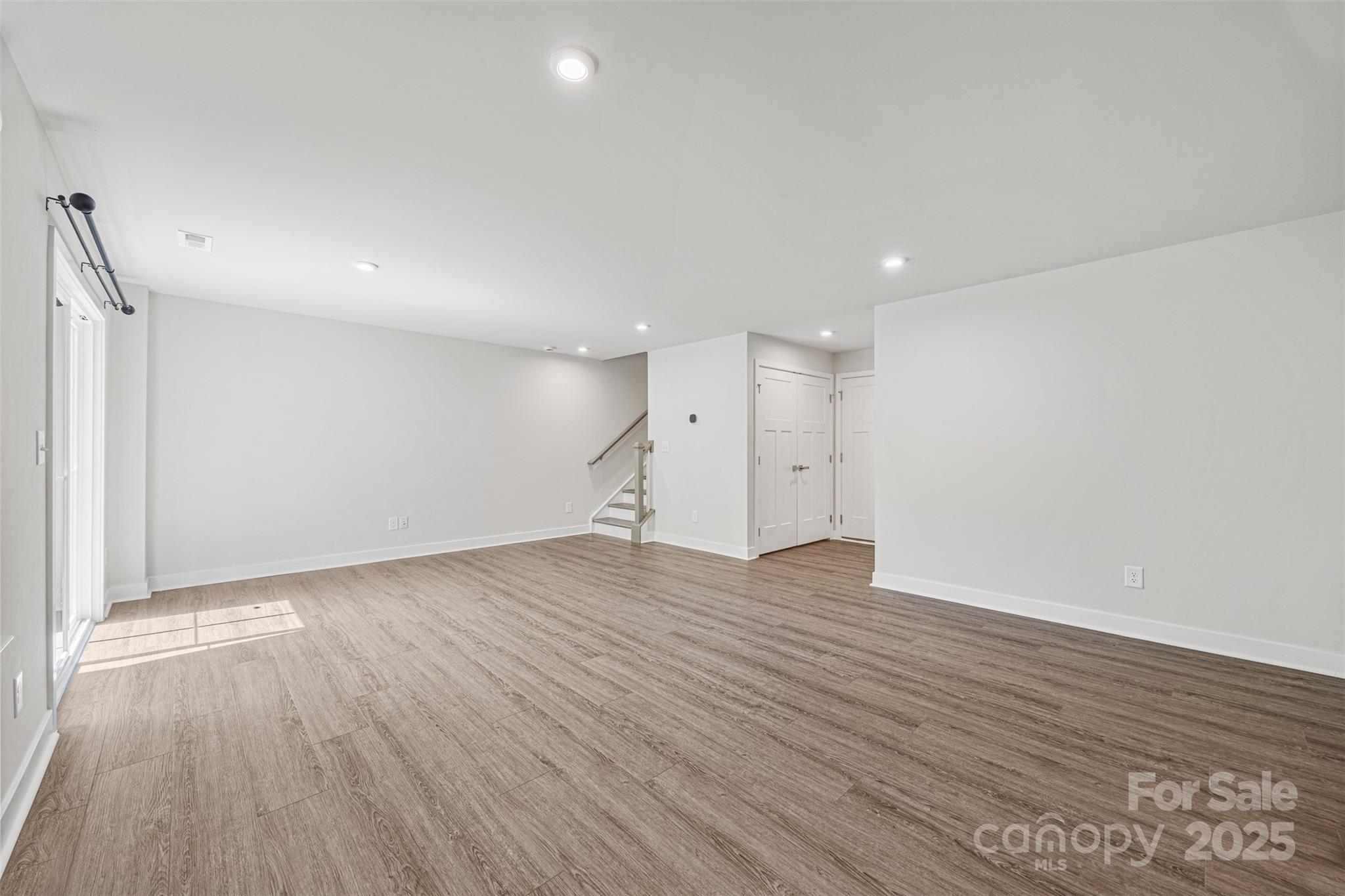 2040 Dornoch Road Tega Cay, SC 29708 - Photo 12 of 30 a view of an empty room with wooden floor