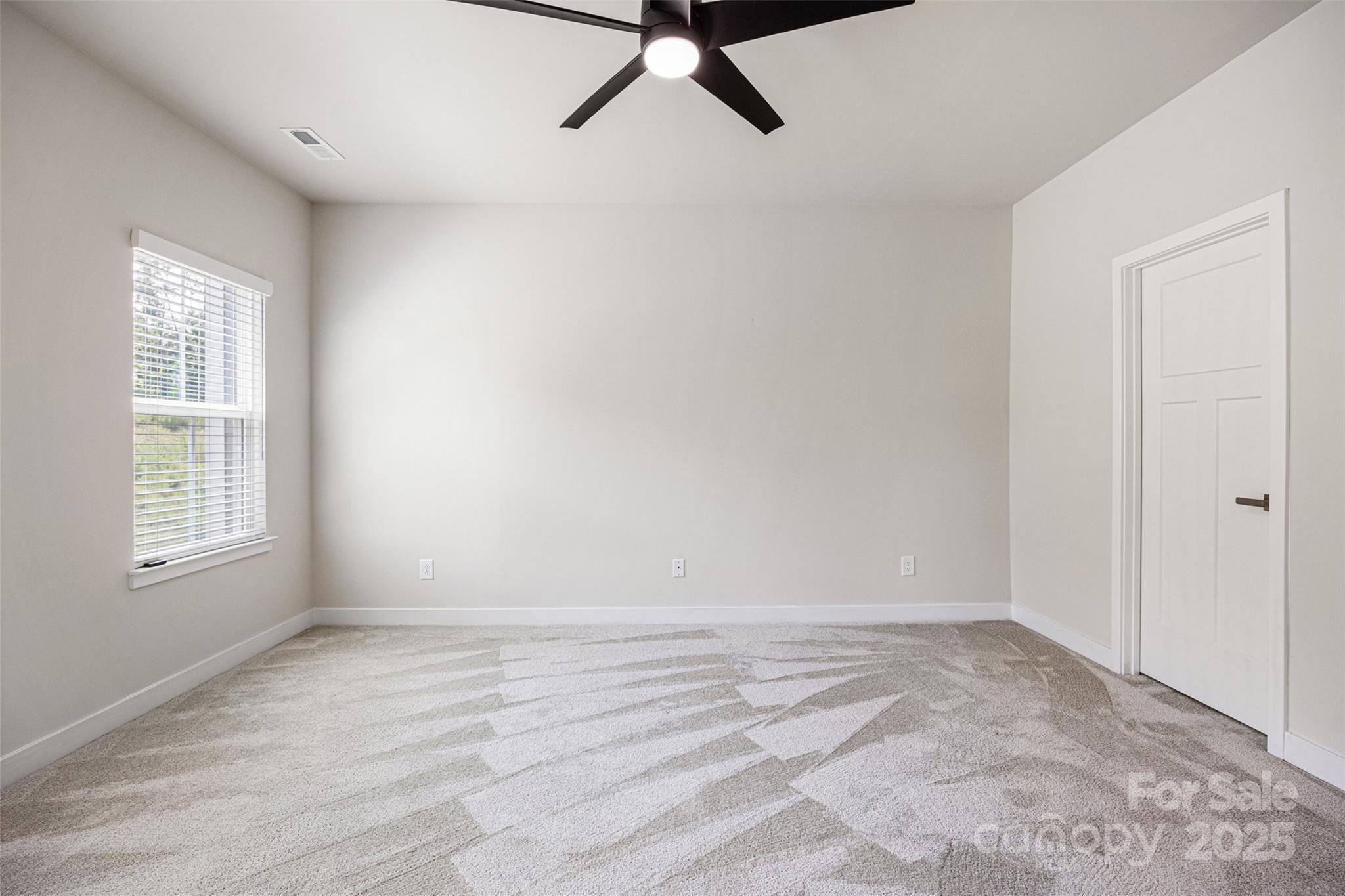 2040 Dornoch Road Tega Cay, SC 29708 - Photo 21 of 30 a view of an empty room with a window