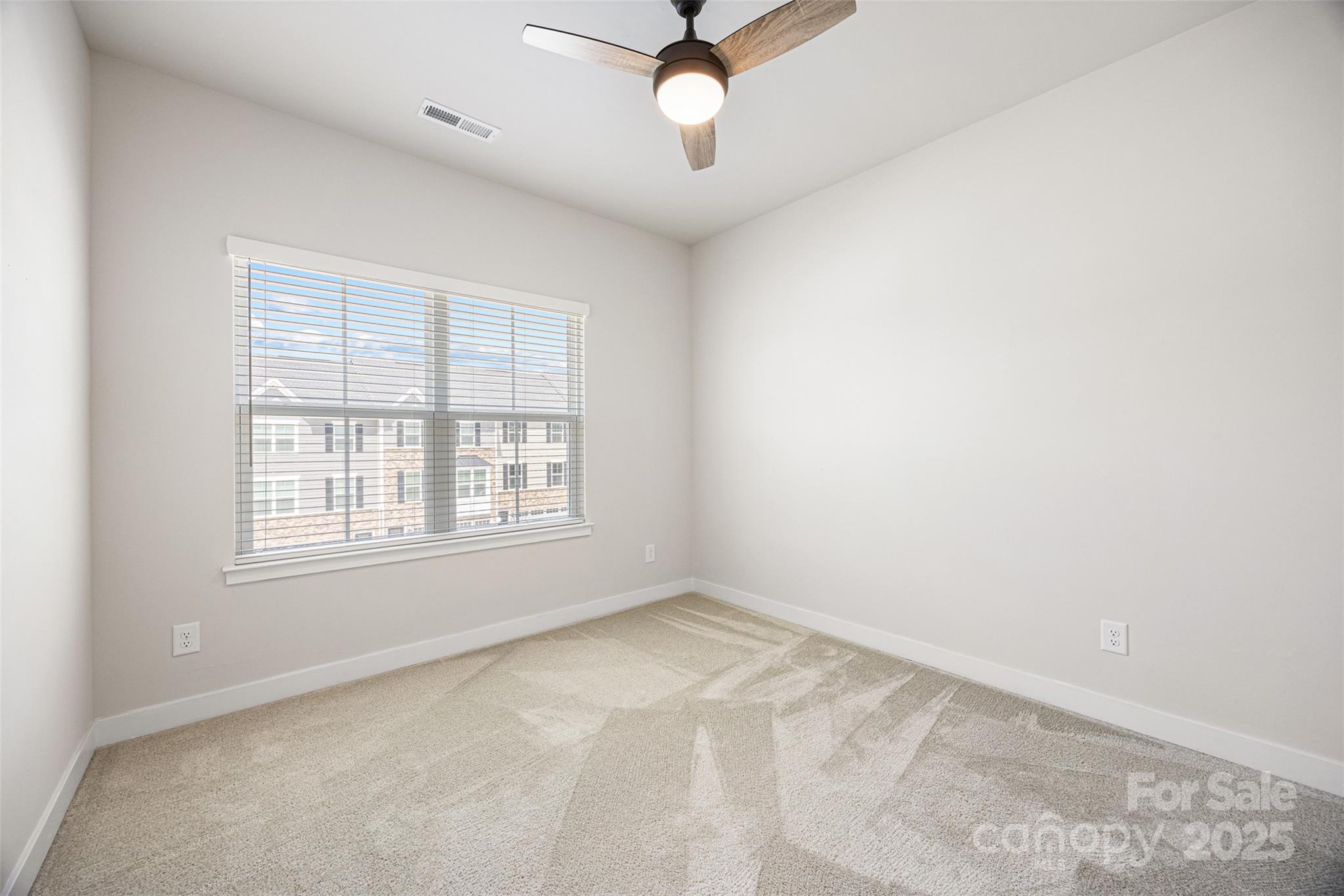 2040 Dornoch Road Tega Cay, SC 29708 - Photo 22 of 30 an empty room with a window