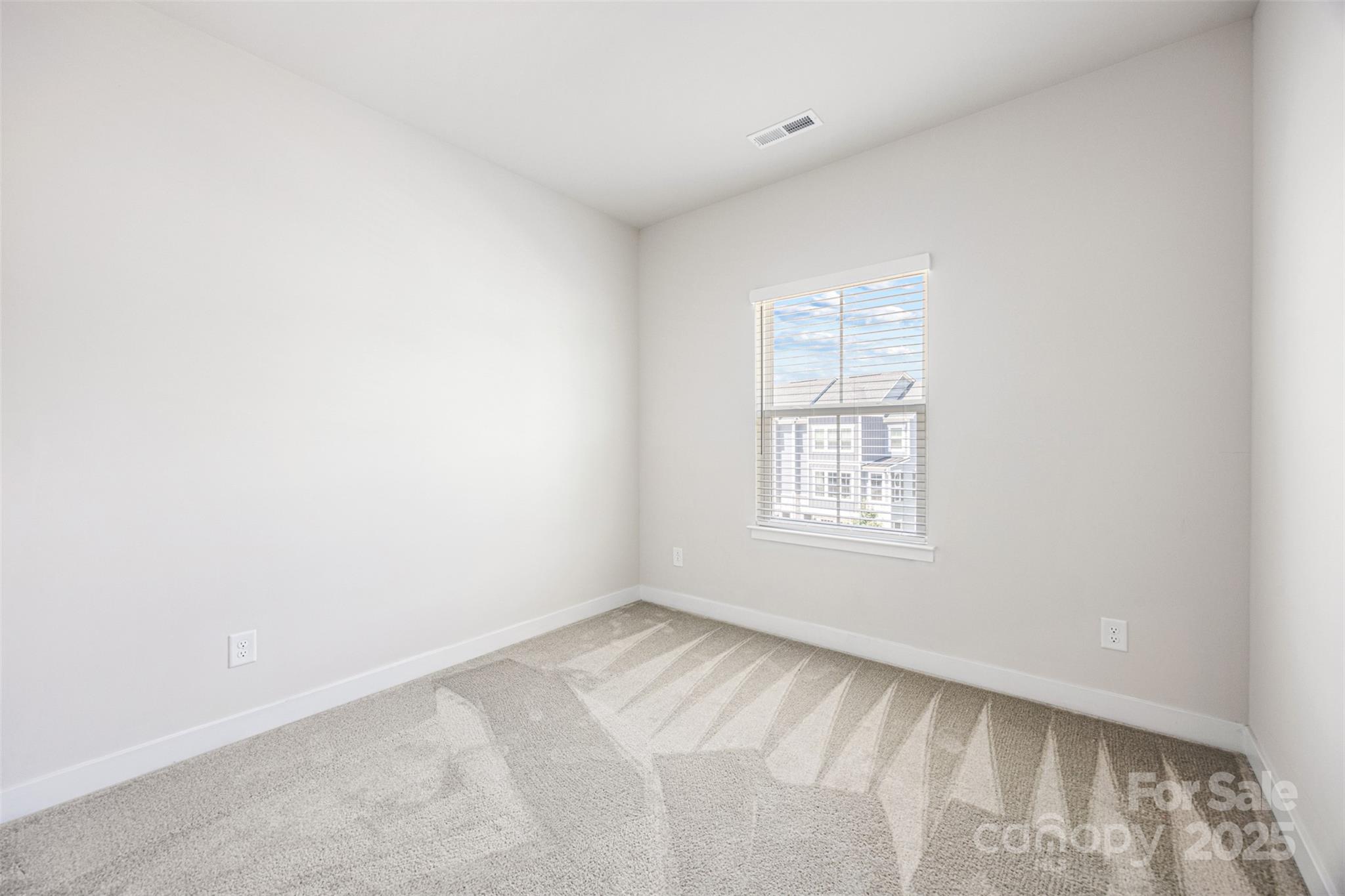 2040 Dornoch Road Tega Cay, SC 29708 - Photo 23 of 30 a view of an empty room with a window