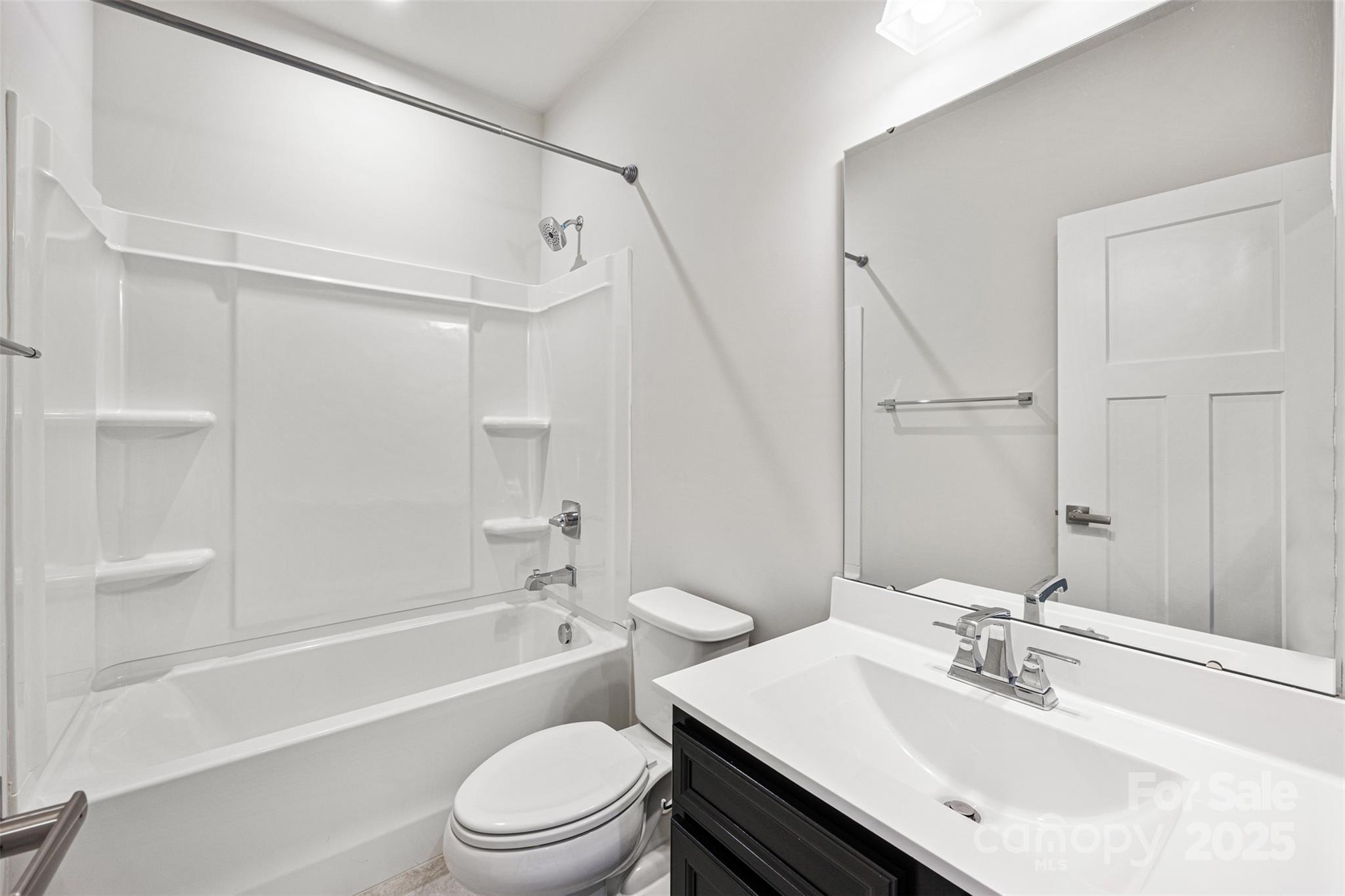 2040 Dornoch Road Tega Cay, SC 29708 - Photo 24 of 30 a bathroom with a sink toilet vanity and shower