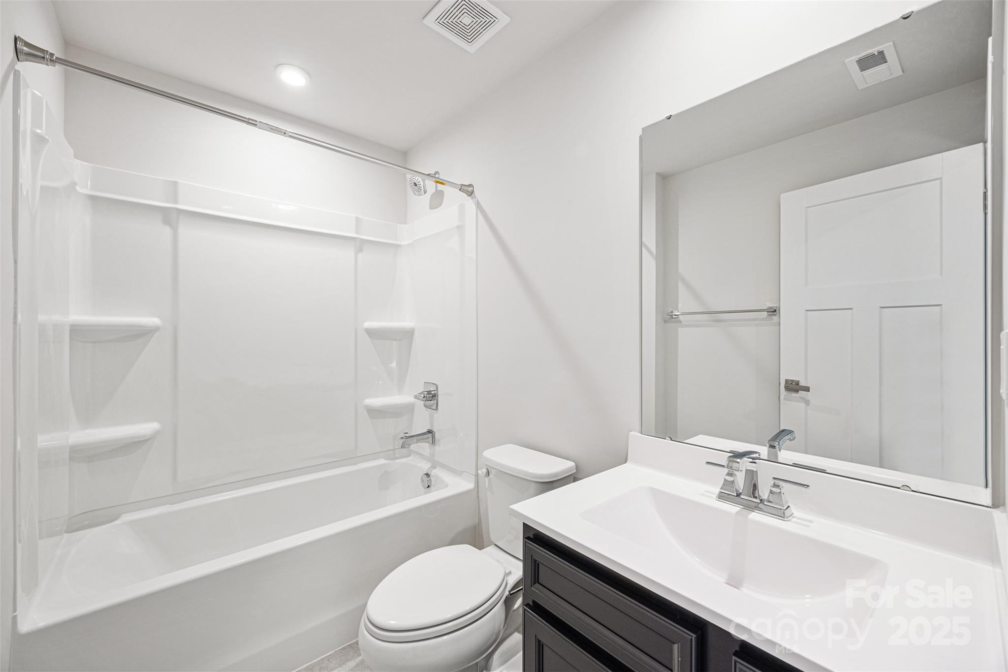 2040 Dornoch Road Tega Cay, SC 29708 - Photo 5 of 30 a bathroom with a sink a toilet and a bathtub