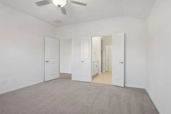 a bathroom with double sink and a mirror