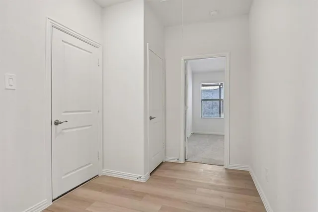 a bedroom with bed and a window