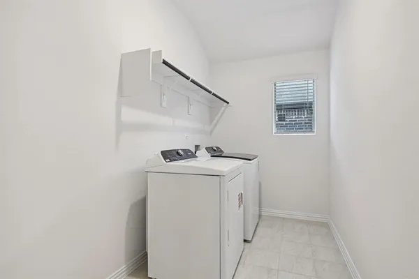 a view of a backyard with wooden fence