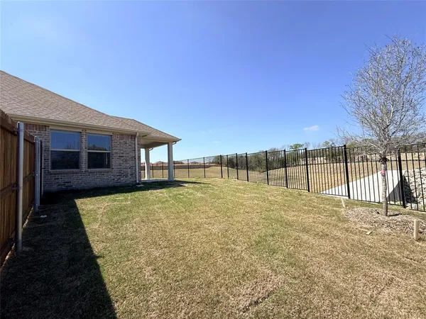 a house with yard in front of it