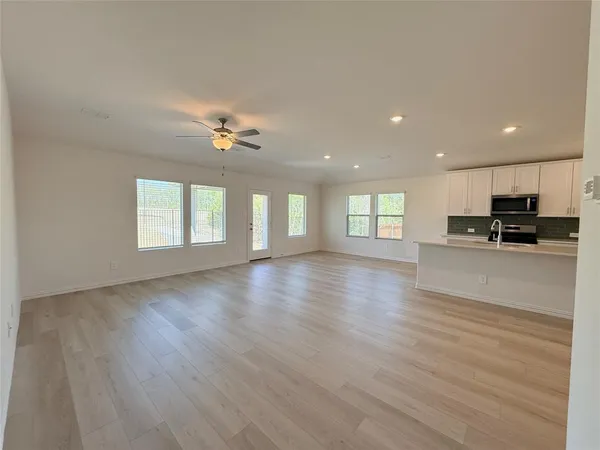 a view of kitchen with wooden floor