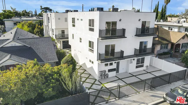 a white building with glass windows and table