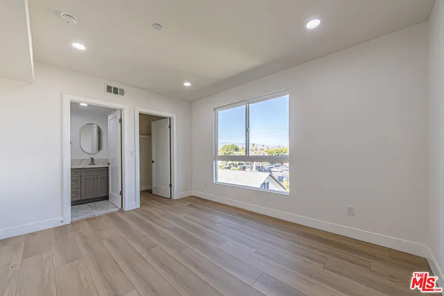 a view of an empty room and a window
