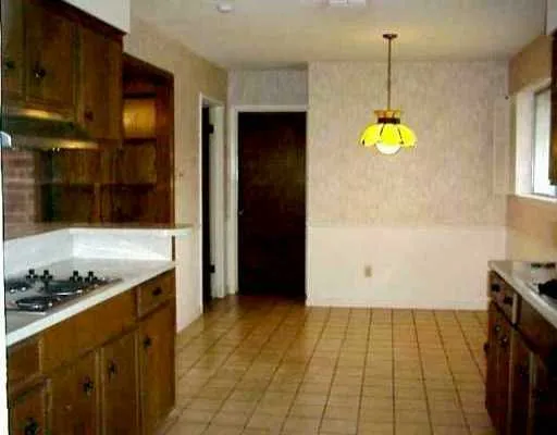 a kitchen with a sink and a stove