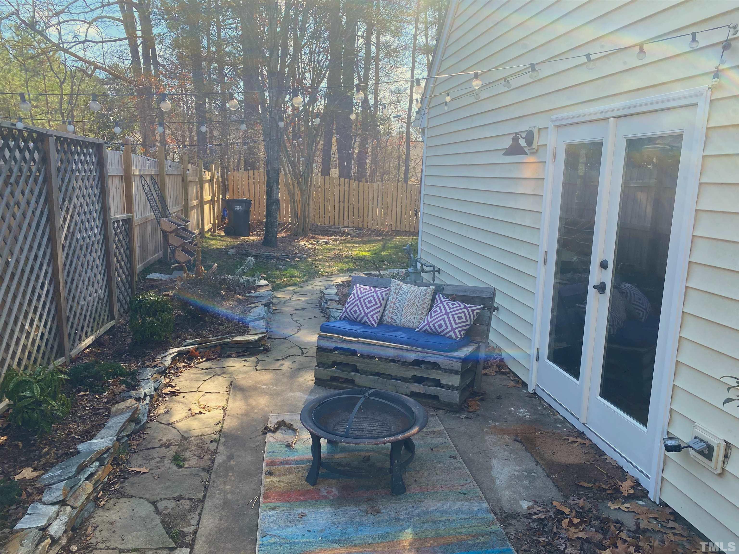 5104 Gable Ridge Drive Durham, NC 27713 - Photo 14 of 16 a view of a chair and table in backyard