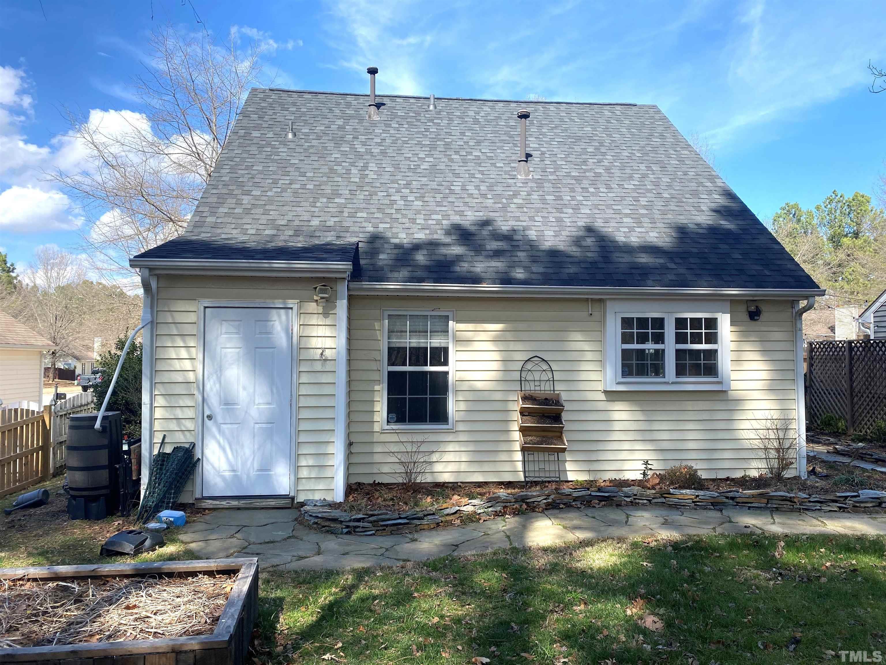 5104 Gable Ridge Drive Durham, NC 27713 - Photo 15 of 16 a front view of a house with garden