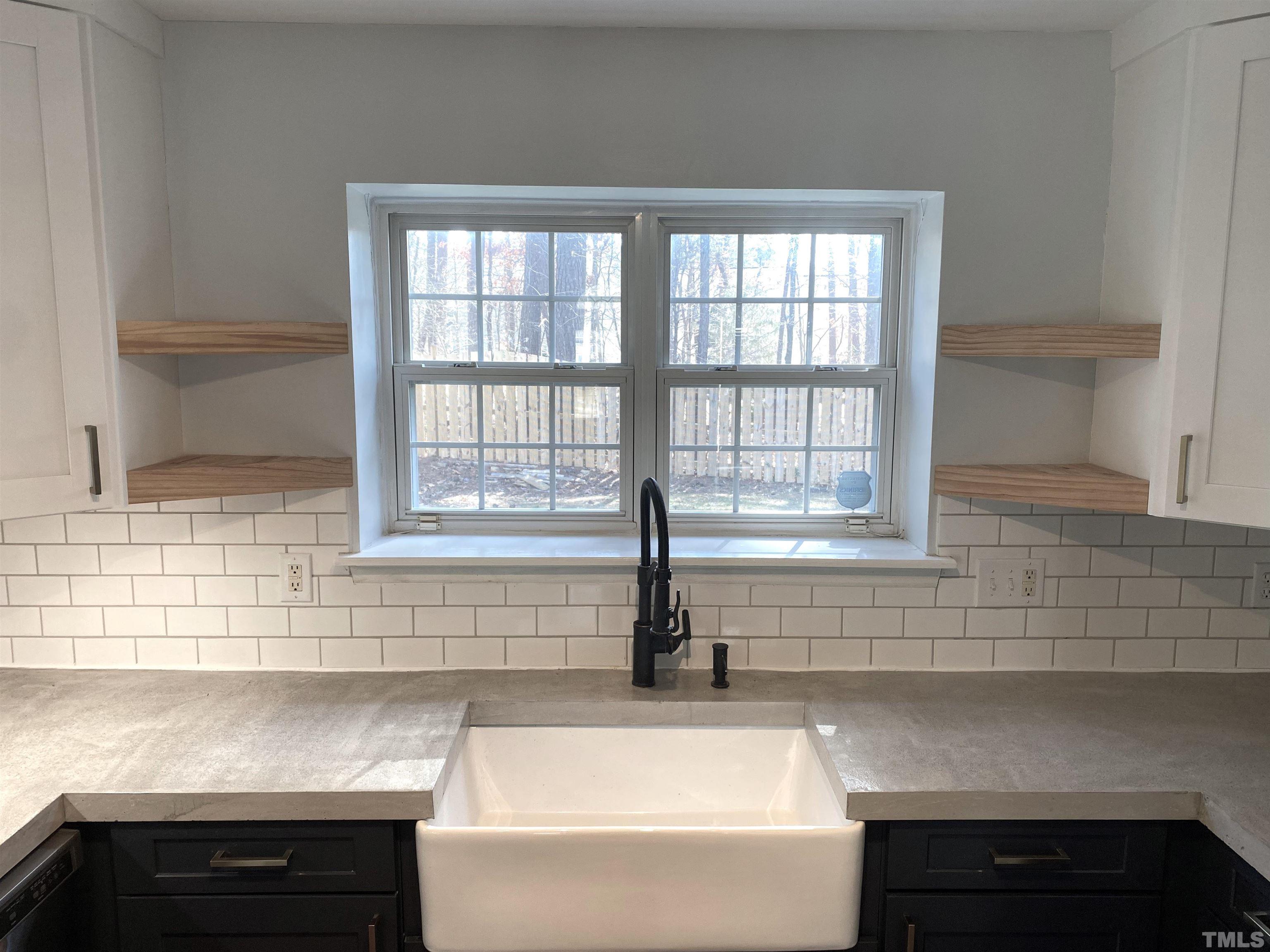 5104 Gable Ridge Drive Durham, NC 27713 - Photo 5 of 16 a kitchen with a sink and a window