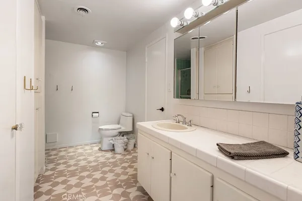 a bathroom with a glass shower door