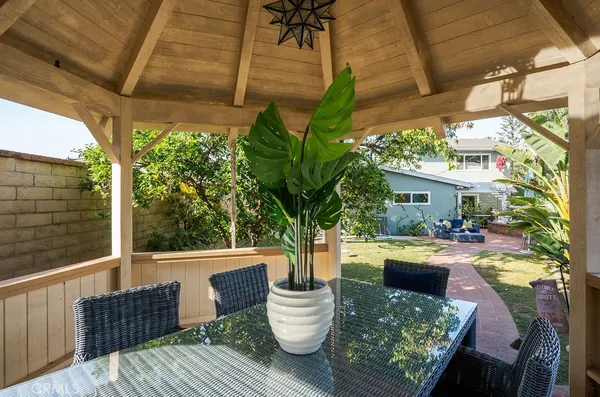 a view of backyard of house with green space