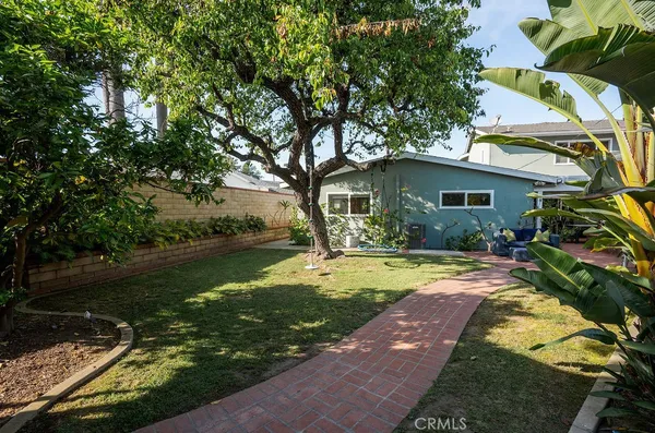 an aerial view of a house with a swimming pool and outdoor seating