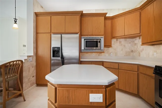 a spacious bedroom with a bed and a flat screen tv