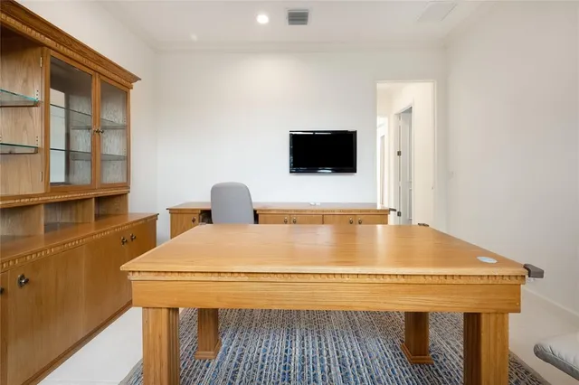 a view of a big room with windows and closet
