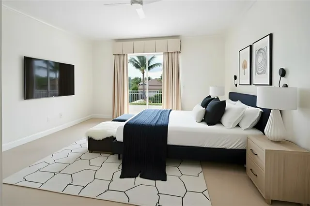 a view of a chair and table in the back yard of the house