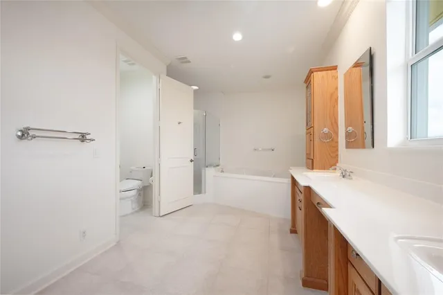 a front view of a house with a yard table and chairs