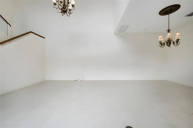 a kitchen with kitchen island granite countertop a sink a counter top space stainless steel appliances and cabinets