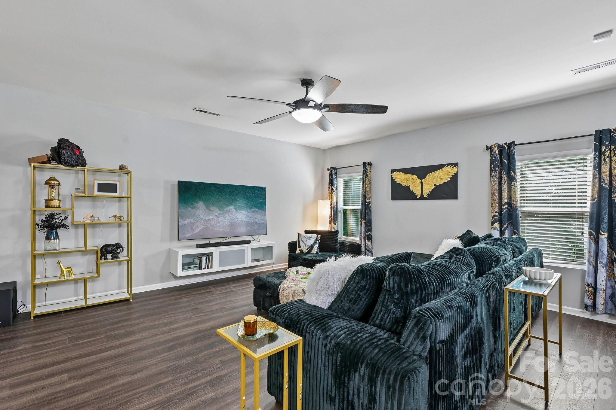 2206 Turtle Point Road Charlotte, NC 28262 - Photo 5 of 28 a living room with furniture and a flat screen tv with wooden floor
