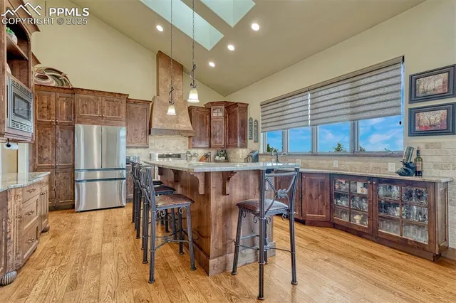 a stove top oven sitting inside of a kitchen
