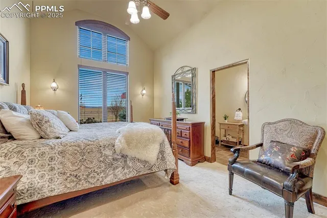 a living room with furniture ceiling fan and a wooden floor
