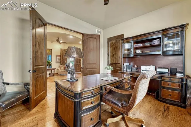 a bedroom with a bed and a television