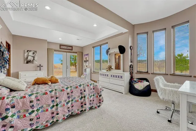 a bathroom with a granite countertop sink a mirror and a shower