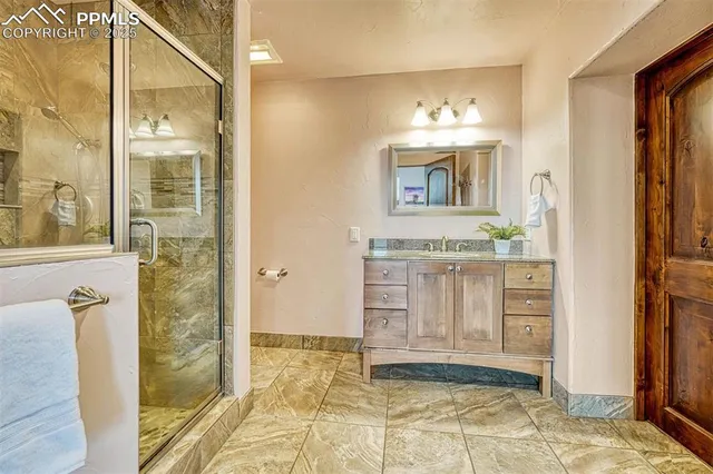 a bedroom with a large bed and a flat screen tv