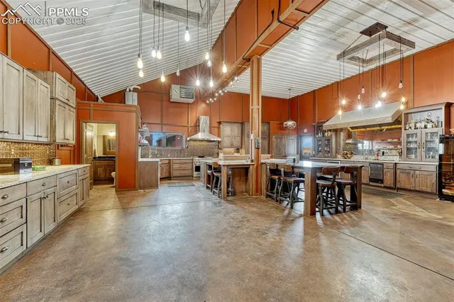 a kitchen with stainless steel appliances granite countertop a stove and a cabinets
