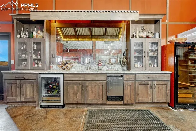 a kitchen with stainless steel appliances a sink and cabinets
