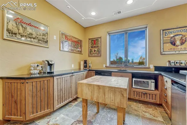 a view of a patio with couches chairs and wooden floor