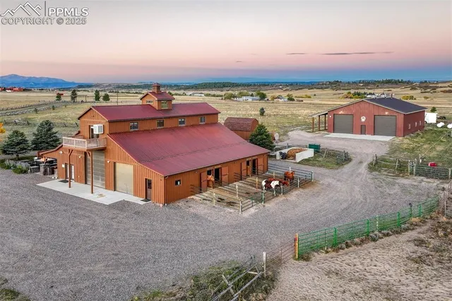 an aerial view of a house with outdoor space