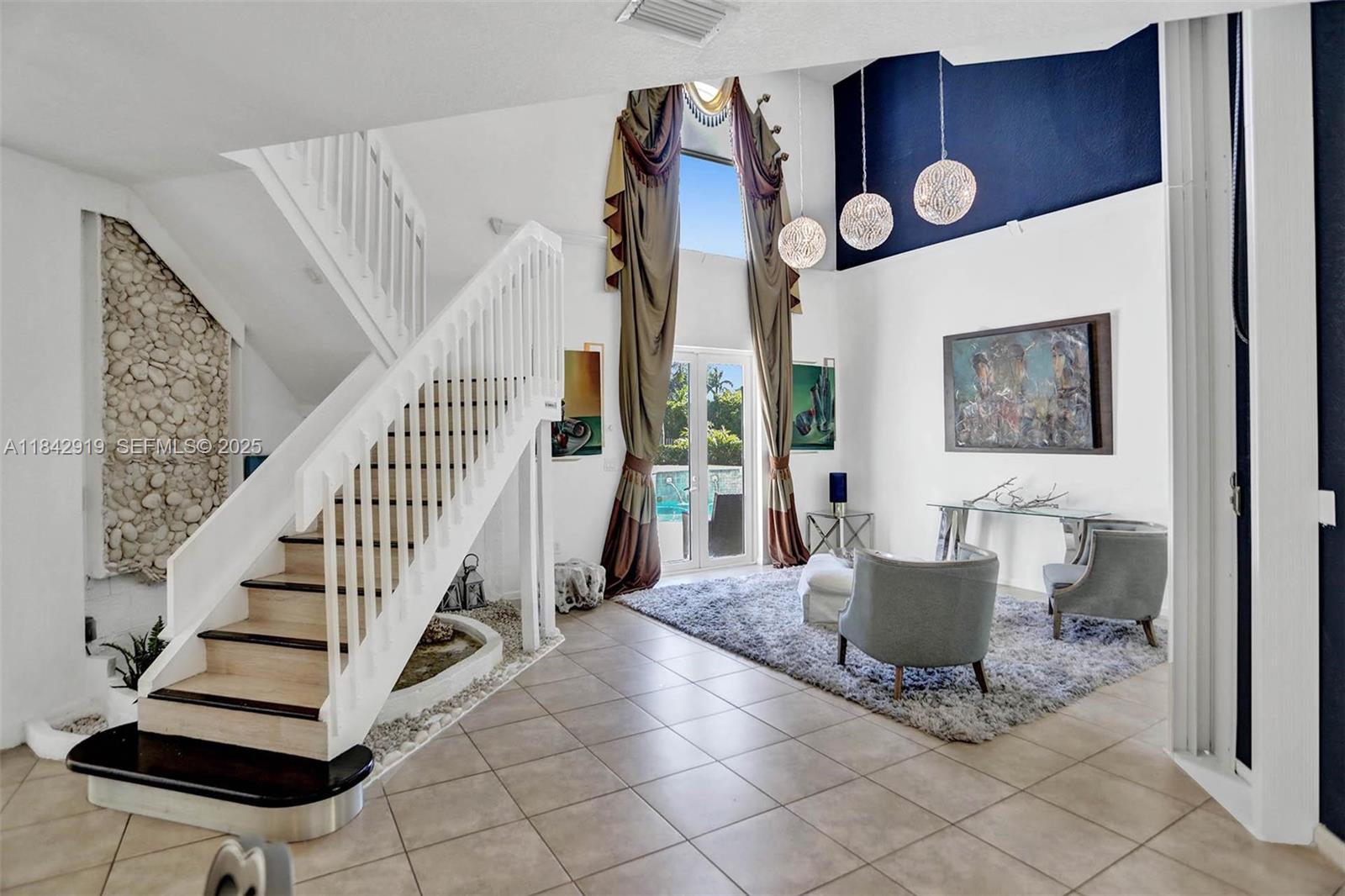 721 Ranch Road Weston, FL 33326 - Photo 24 of 38 a view of entryway kitchen and hall with wooden floor