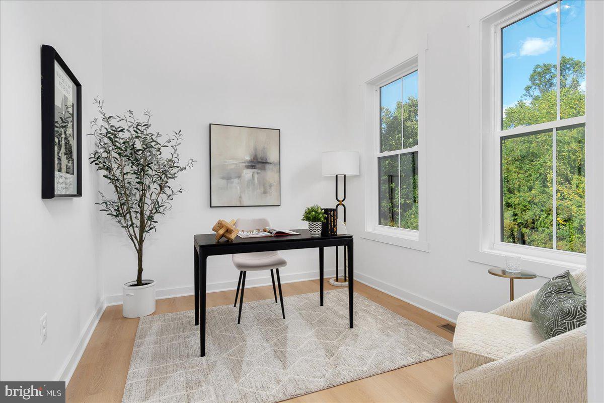 6508 Shady Side Road Shady Side, MD 20764 - Photo 14 of 35 a living room with furniture and a potted plant