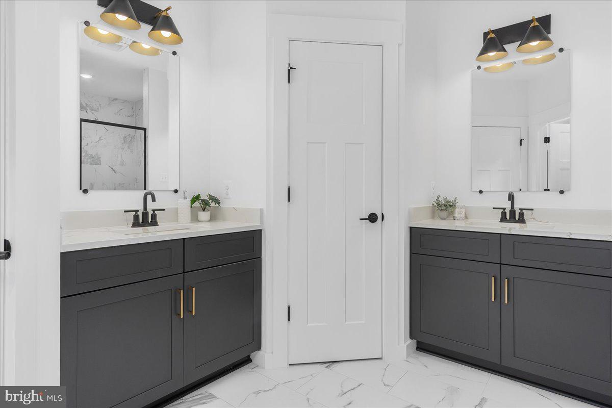 6508 Shady Side Road Shady Side, MD 20764 - Photo 19 of 35 a bathroom with a sink vanity and mirror