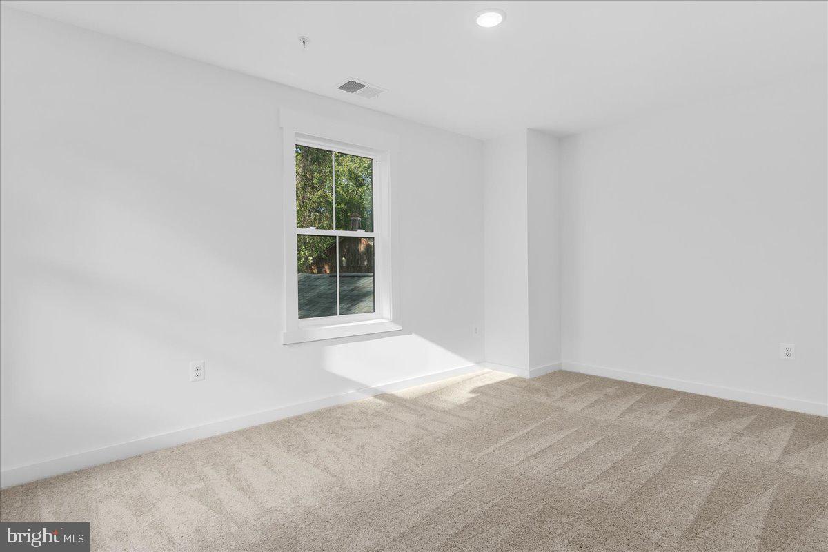 6508 Shady Side Road Shady Side, MD 20764 - Photo 22 of 35 an empty room with a window