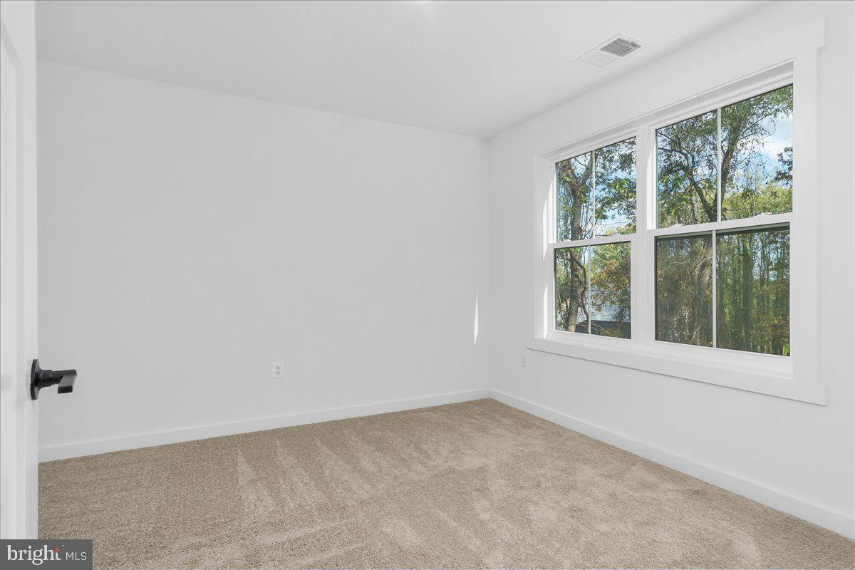 6508 Shady Side Road Shady Side, MD 20764 - Photo 23 of 35 an empty room with a window