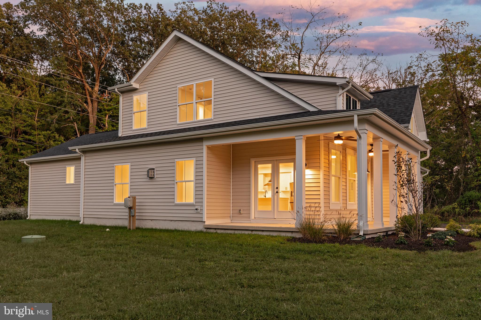 6508 Shady Side Road Shady Side, MD 20764 - Photo 33 of 35 a front view of a house with a garden