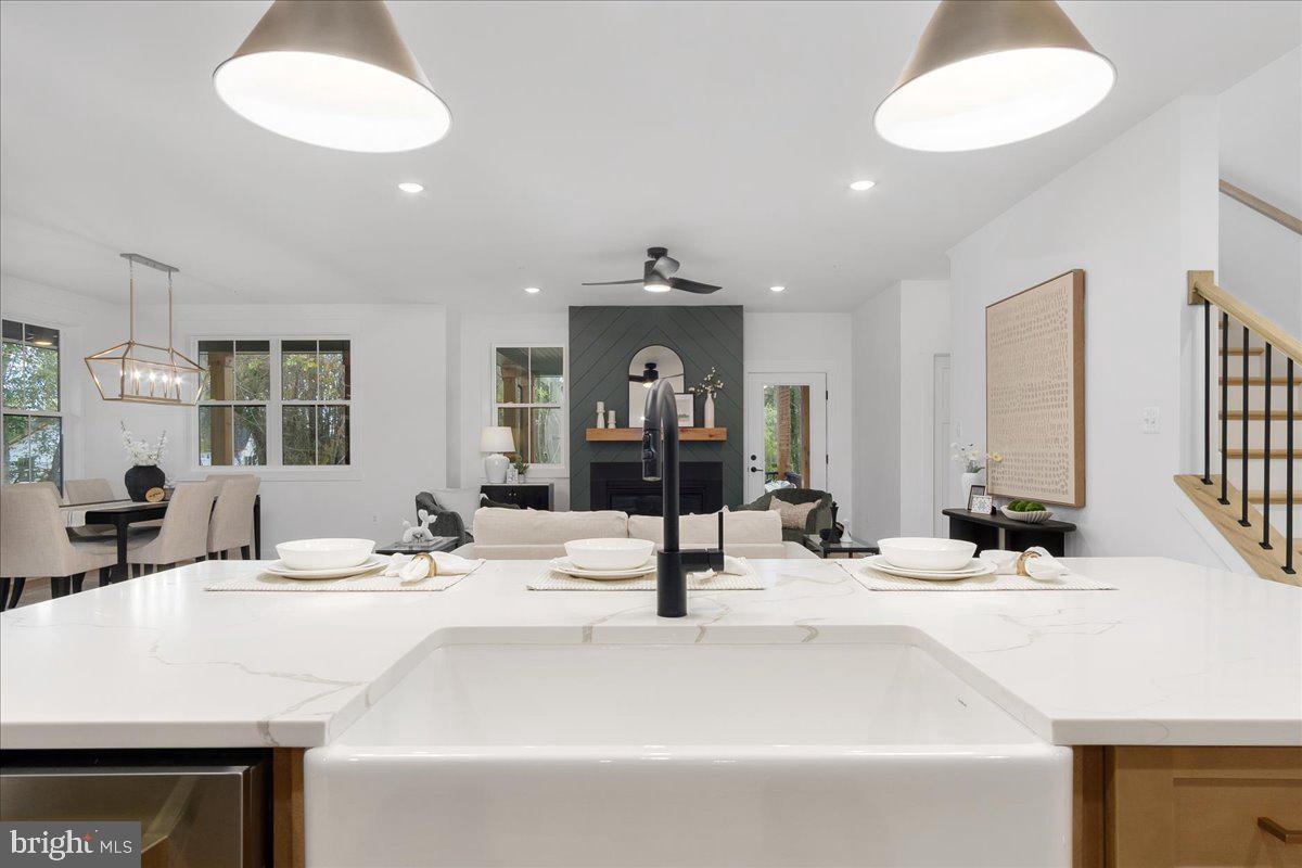 6508 Shady Side Road Shady Side, MD 20764 - Photo 6 of 35 a bathroom with a sink and a mirror