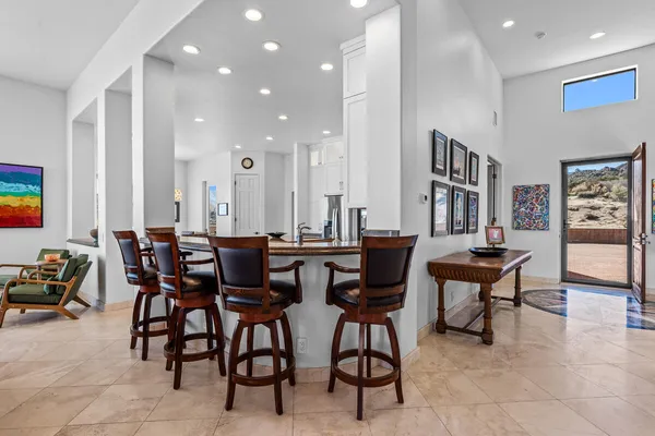 a kitchen with stainless steel appliances granite countertop a stove refrigerator sink and microwave