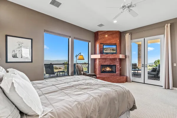 a bedroom with a bed and a book shelf