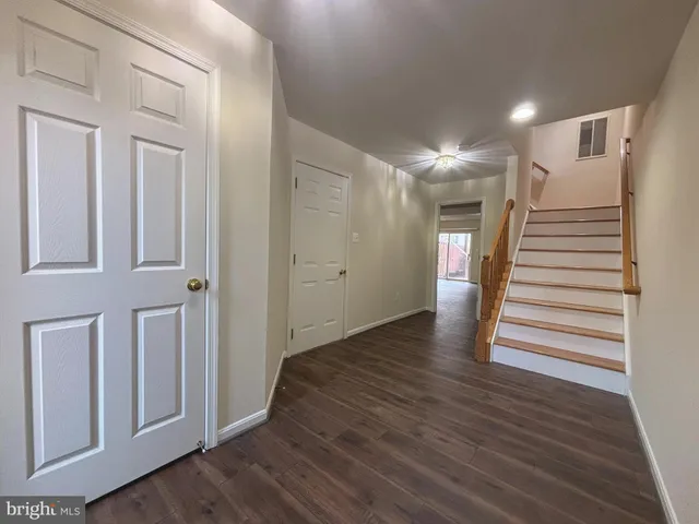 a view of entryway with stairs and wooden floor