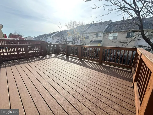 a view of balcony with wooden floor and city view