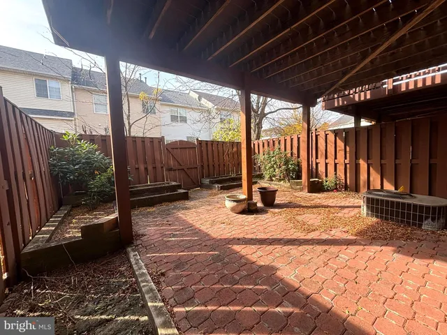 a view of a backyard with sitting area