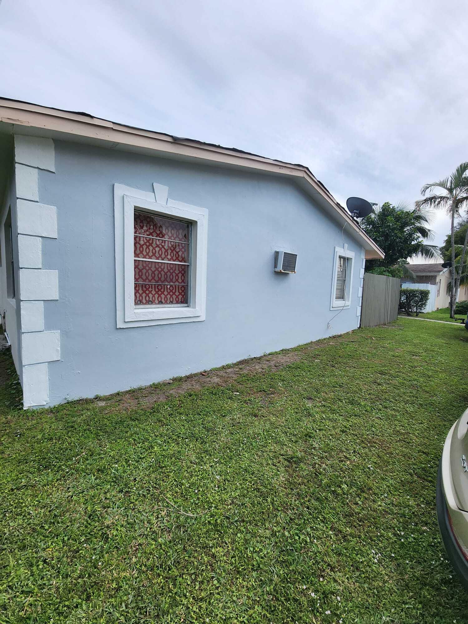 3386 Rudolph Road Lake Worth Beach, FL 33461 - Photo 25 of 25 a house view with a garden space