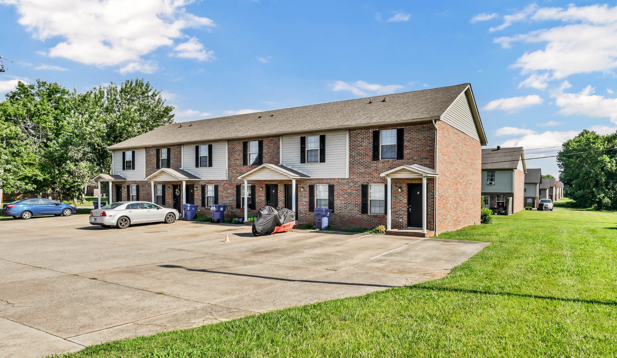 2451 Wilson Road, Unit 6 Clarksville, TN 37043 - Photo 18 of 21 a view of a house with a big yard and large trees